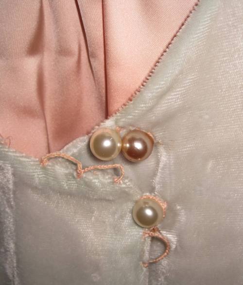 Pearl button closures on Bonnie's velvet coat 